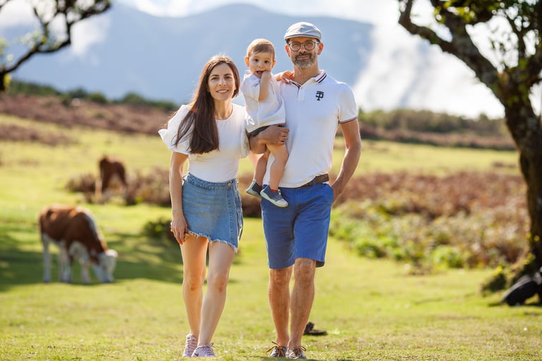 Family walking together through misty ancient forest during afternoon photography session at Fanal