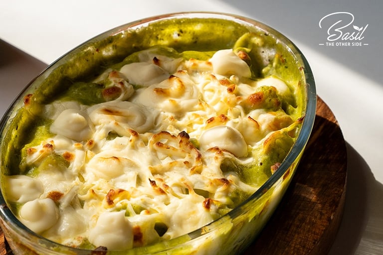 a dish of pasta with broccoli and cheese