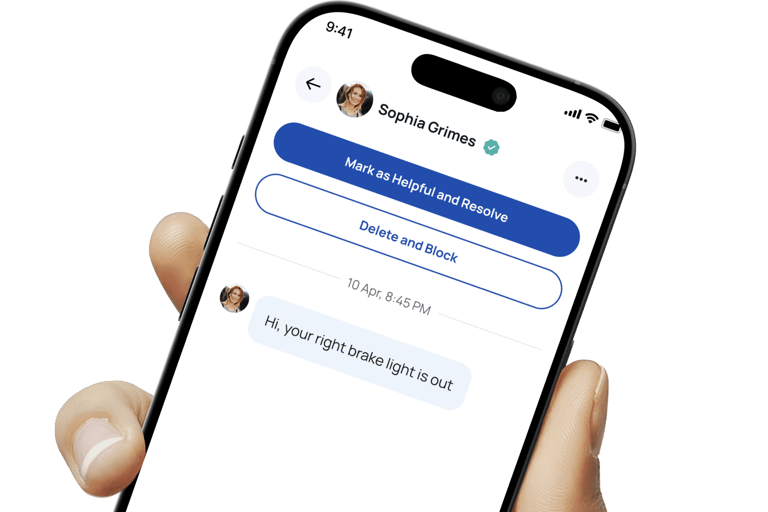 Hand holding a phone with the Blinker app shown on it