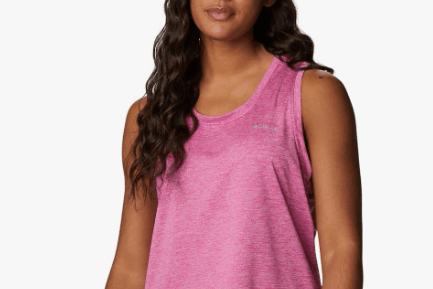 a woman in a pink tank top and shorts