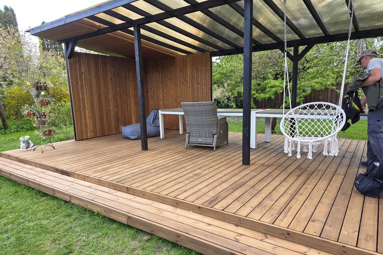 a man standing on a deck with a backpack