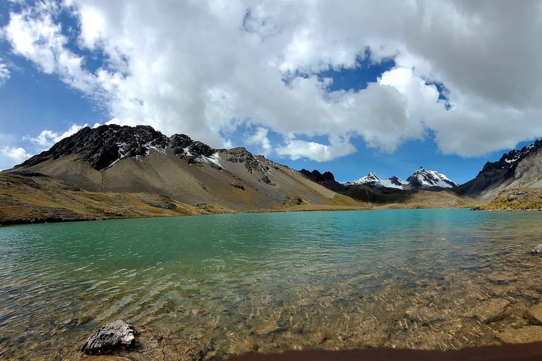 a lake with a mountain in the background