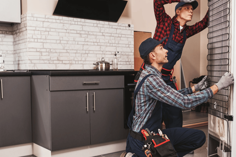 a man and woman working on a brick wall