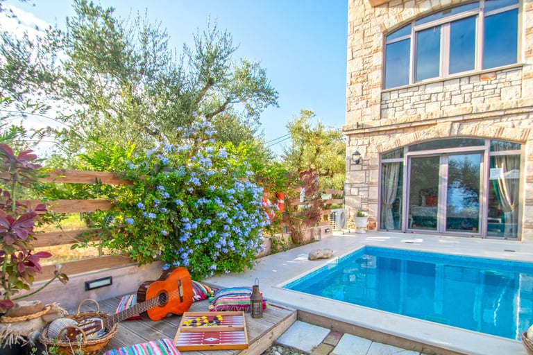 a pool with a leisure and a patio area