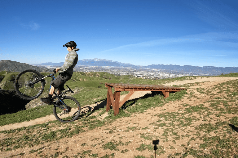 mountain biker going off drop