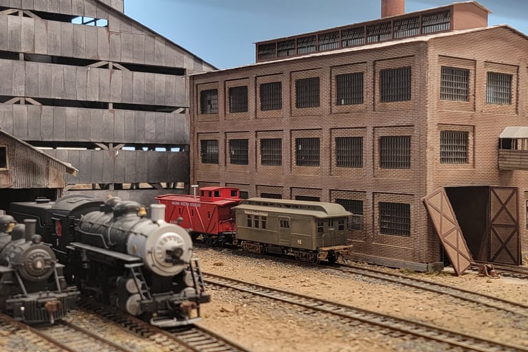 Superior Mine diorama with locomotive and mine buildings.