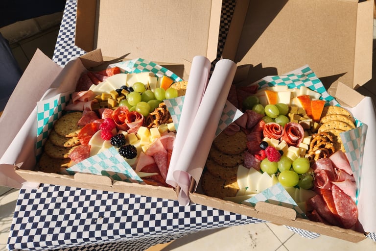 a box of food in a box with a checkered table cloth