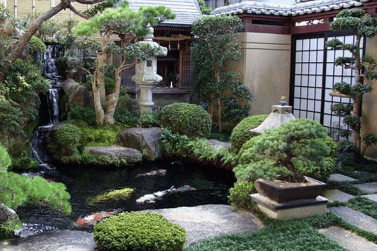 a garden with a pond and a waterfall