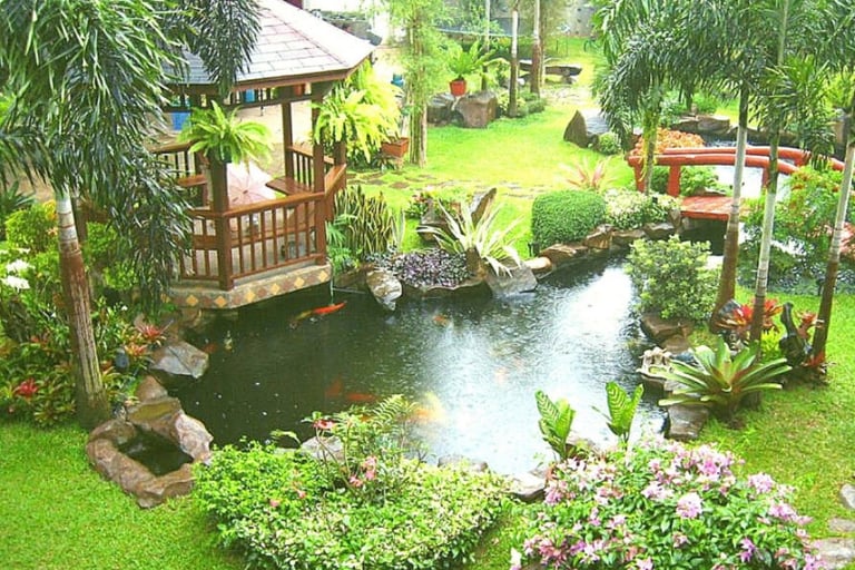 a garden with a gazeboar and a gazeboar