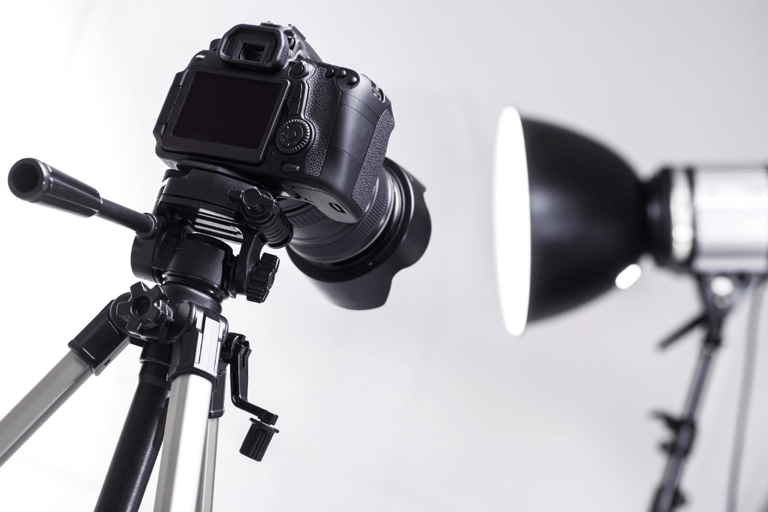 a camera and a light on a tripod