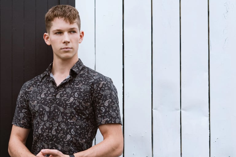 Portrait photo of a young man in an industrial black and white environment