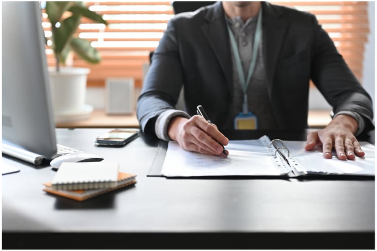 image of accountant office with accountant at desk