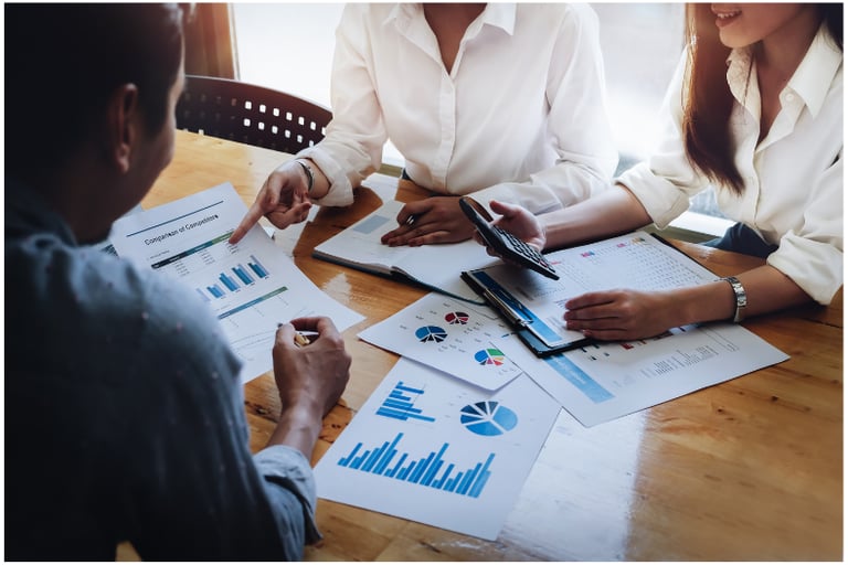 accountant with business owners with business forms