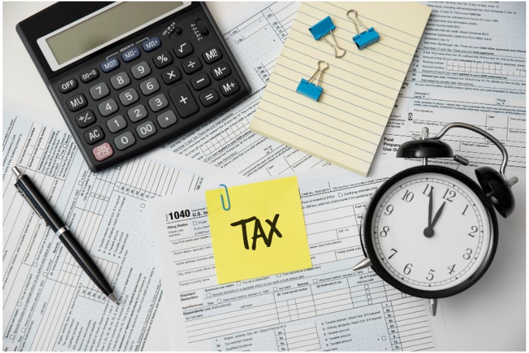 image of tax forms with clock