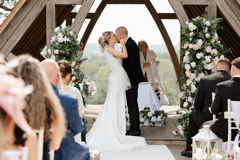 bride and groom first kiss at highley manor
