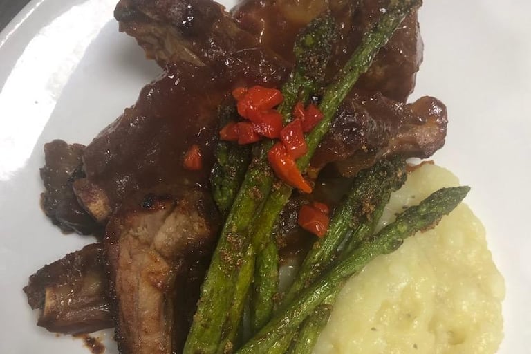 Baby back ribs, garlic & basil mashed potatoes, sautéed asparagus