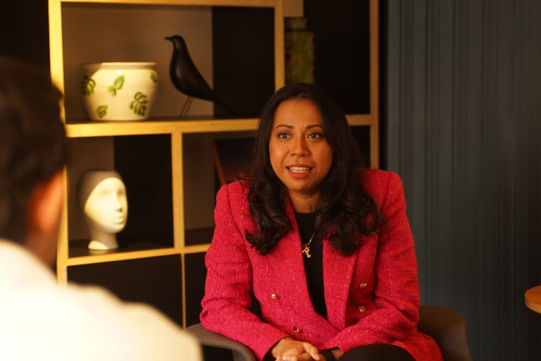 a woman in a pink jacket and a man in a white shirt