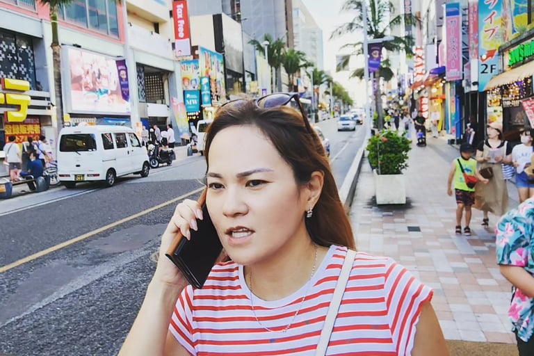 a japanese woman talking on her cell phone