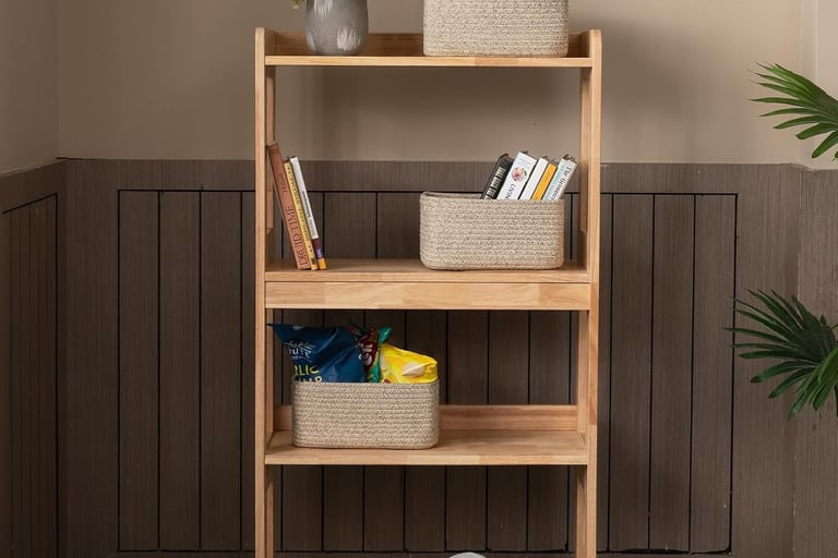 a shelf with woven baskets on it