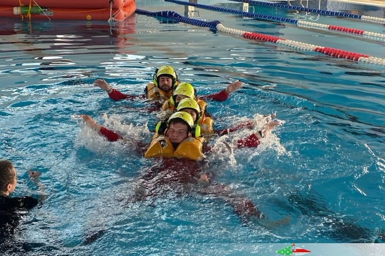 Water Rescue Drill – HEMS trainees practicing water rescue techniques in a controlled pool exercise.