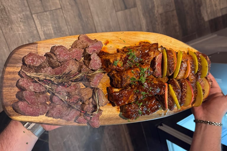 a person holding a large wooden board with steak steak and potatoes
