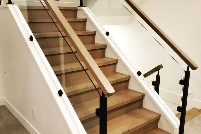 Modern staircase design featuring wood steps and glass railing for contemporary interiors