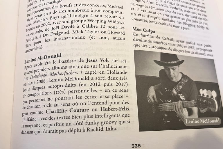 Photo d'une page intérieure de l'encyclopédie ou se trouve Lenine Mc Donald