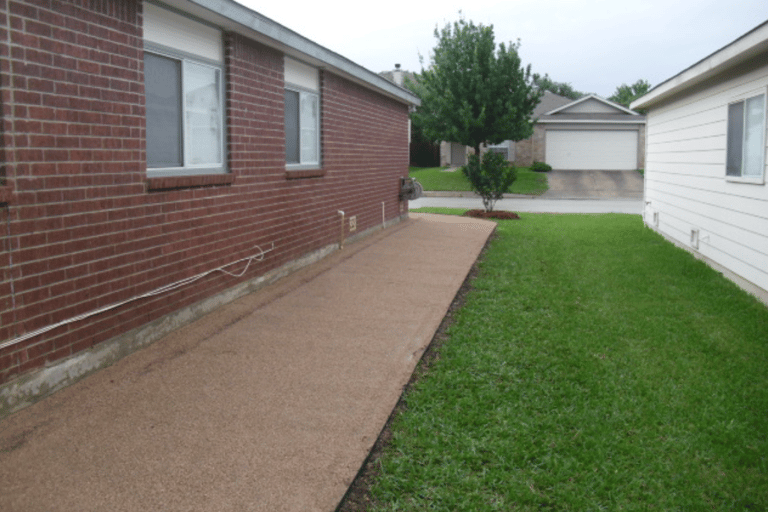 decomposed granite walkway on side of house 