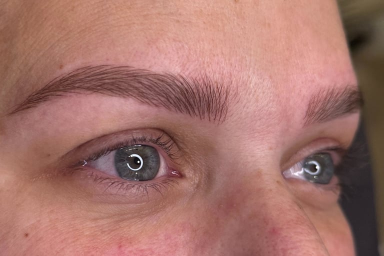 Woman after microblading was done showcasing her natural looking eyebrows