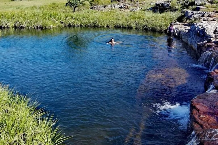 Paradise pools with swimmers in clear water