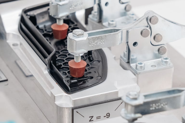 Fixture clamping plastic parts using over center clamps. 