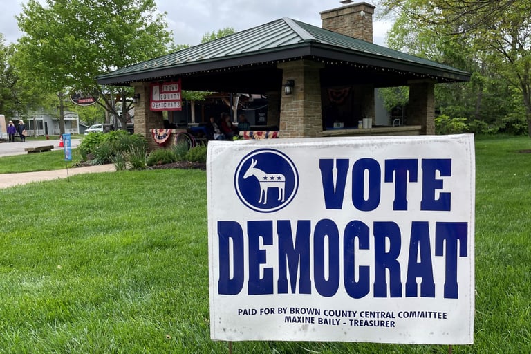 Yard sign reading Vote Democrat in front of downtown Nashville pavilion