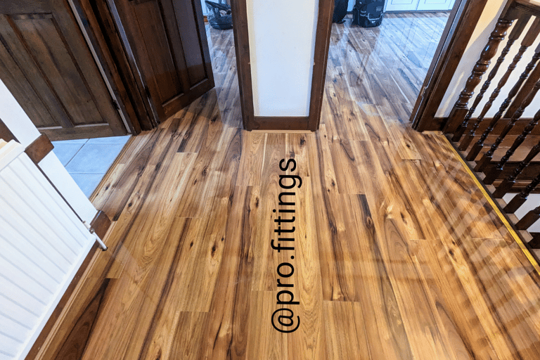 Gloss laminate flooring fitted in Stratford by Pro Fittings Ltd