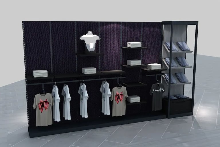 Modern retail clothing display featuring t-shirts on hangers, folded apparel, and a silver mannequin torso.