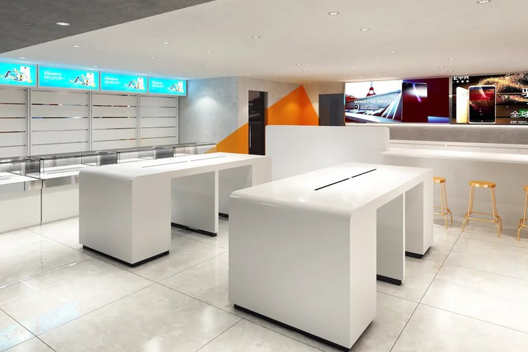 Modern white minimalist mobile phone store interior with sleek display tables and digital signage.