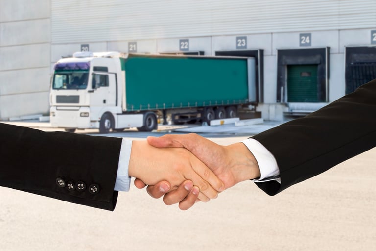 Handshake in front of Truck