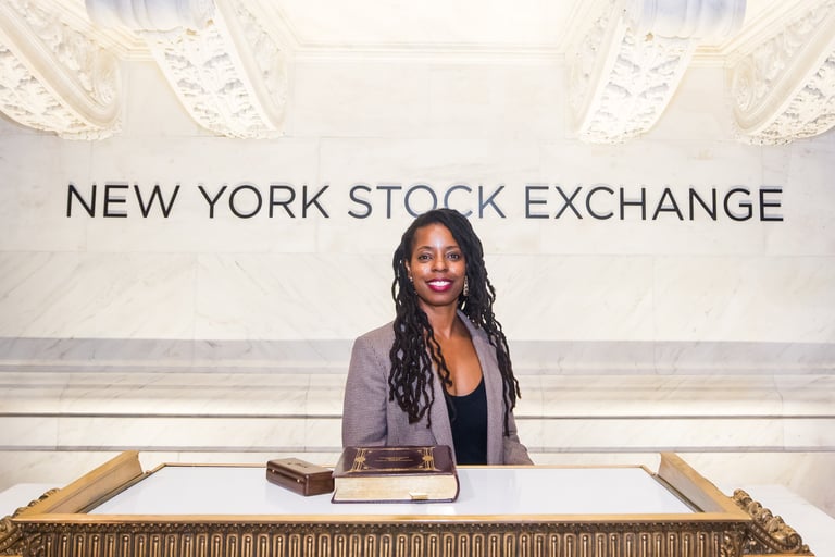 Dorian Price ringing the bell at NYSE for the 50th anniversary of women federal service academies