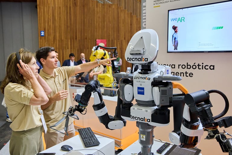 Luis Valdes in an international robotics fair explaining an LLM application with a Kawada robot