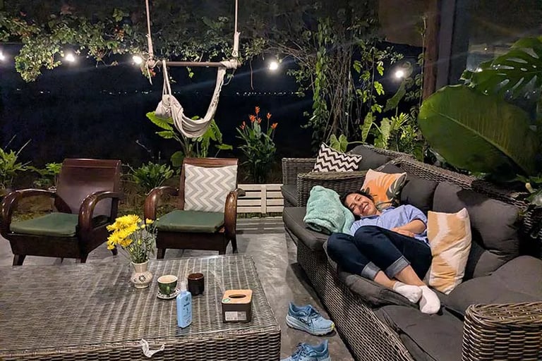 Person sleeping on couch at coworking space in Vietnam
