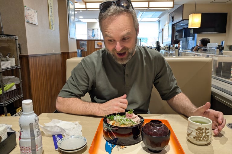 Fresh Japanese seafood rice bowl served in a conveyor belt restaurant.