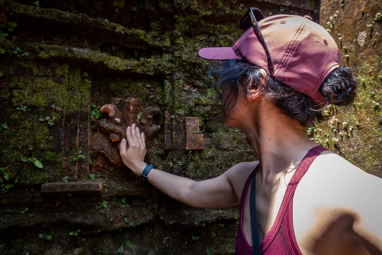 hand touching ancient carved temple wall at my son sanctuary vietnam