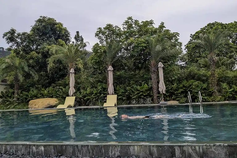 Swimming in the pool to escape the summer heat at a retreat center in northern Vietnam