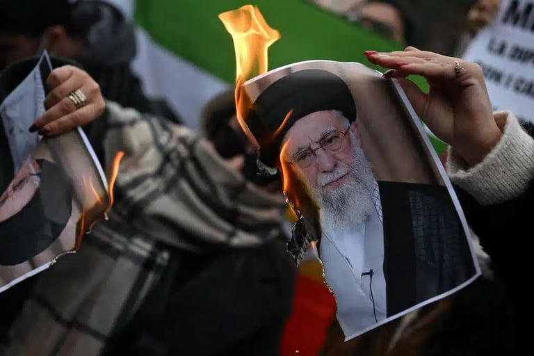 photograph of the Supreme Leader Khamenei being burned