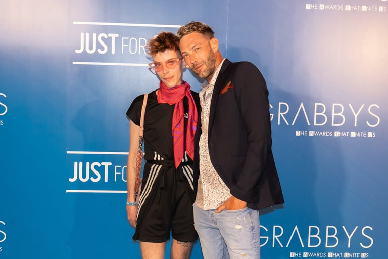 Cobalt FTM and Oscar HM posing for a picture at Grabbys Awards Red Carpet in April 2025