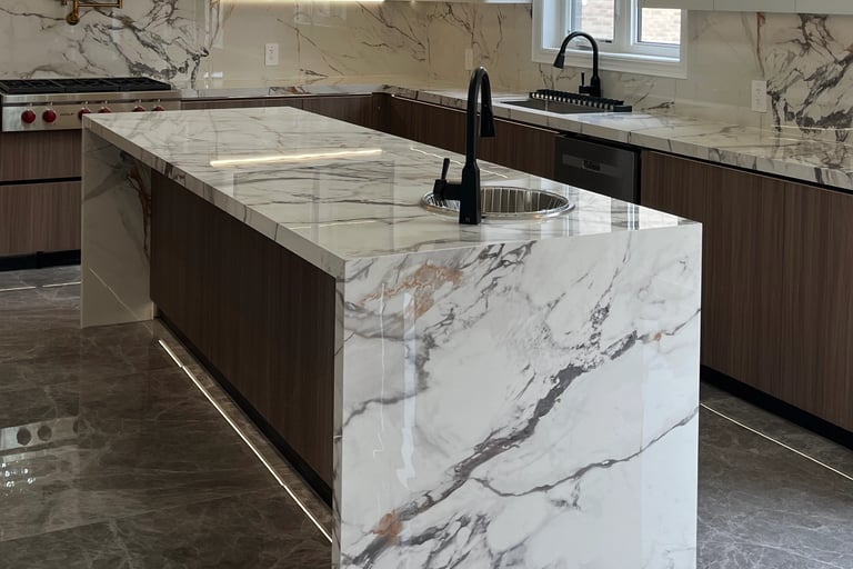 Close-up of a seamless 45-degree mitered edge on a Calacatta Sintered Stone island by Maple Style Li