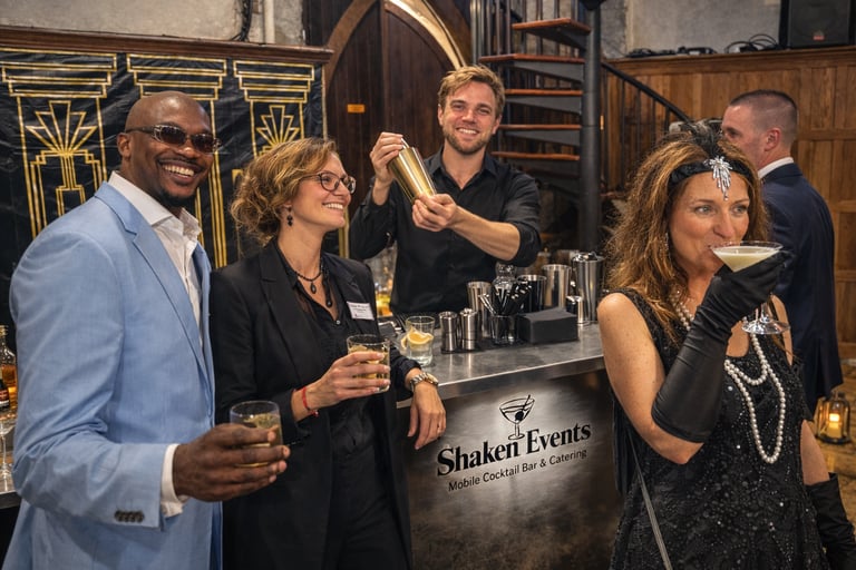 Guests enjoying cocktails part of a beverage package at a Gatsby-themed event