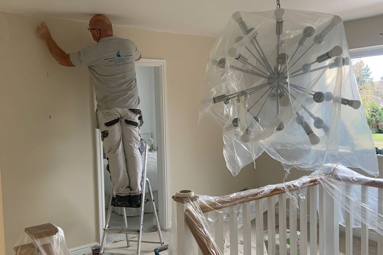 Our staff decorating an interior room in a residential home.