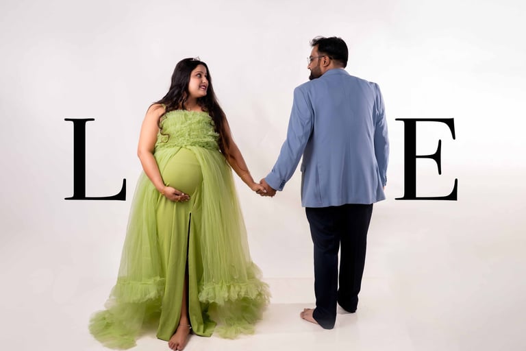 Expecting couple posing during maternity photoshoot in Kolkata