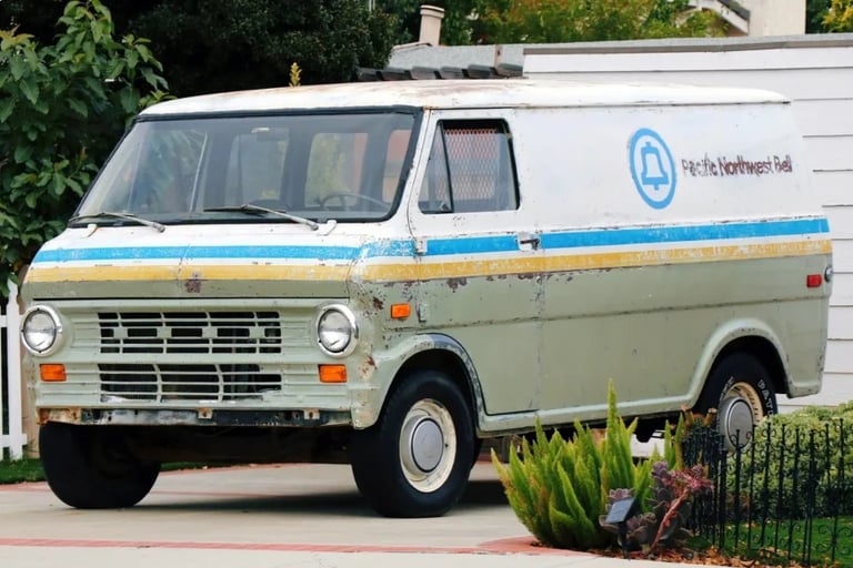 a classic van with a blue and white stripes