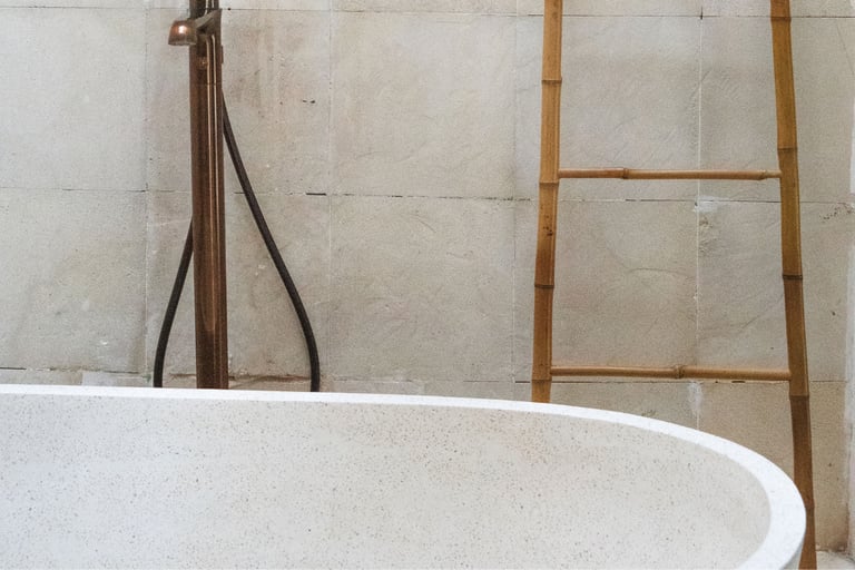 Bath positioned against the wall in a French Mediterranean bathroom.